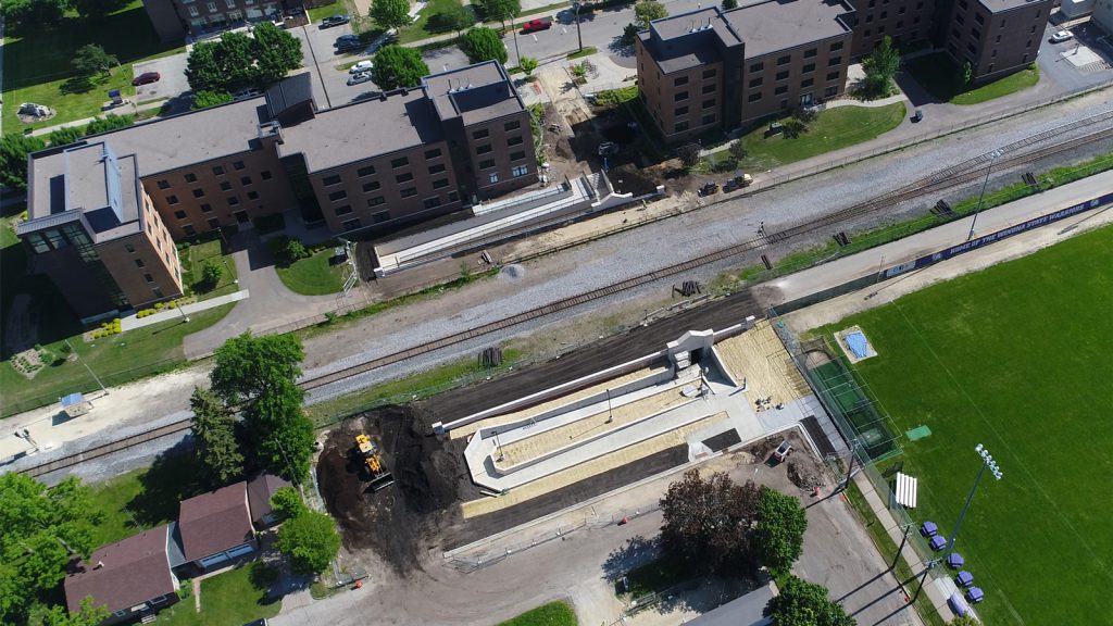 Aerial view of construction of pedestrian tunnel under the train tracks by WSU res halls