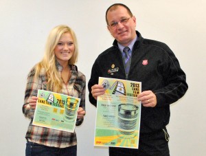 Schwartzbauer and Ferber holding the winning poster and flyer design